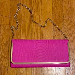 Pink faux snakeskin clutch